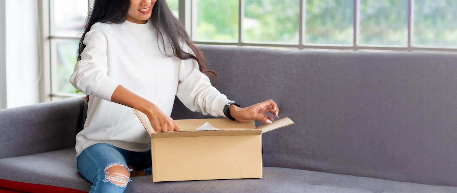woman unboxing package