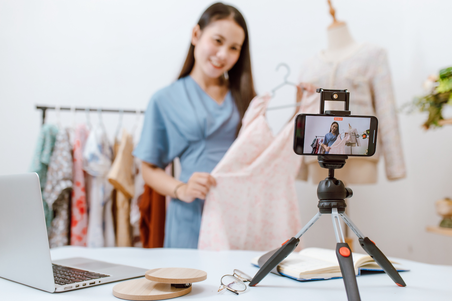 influencer showing her clothing merchandise